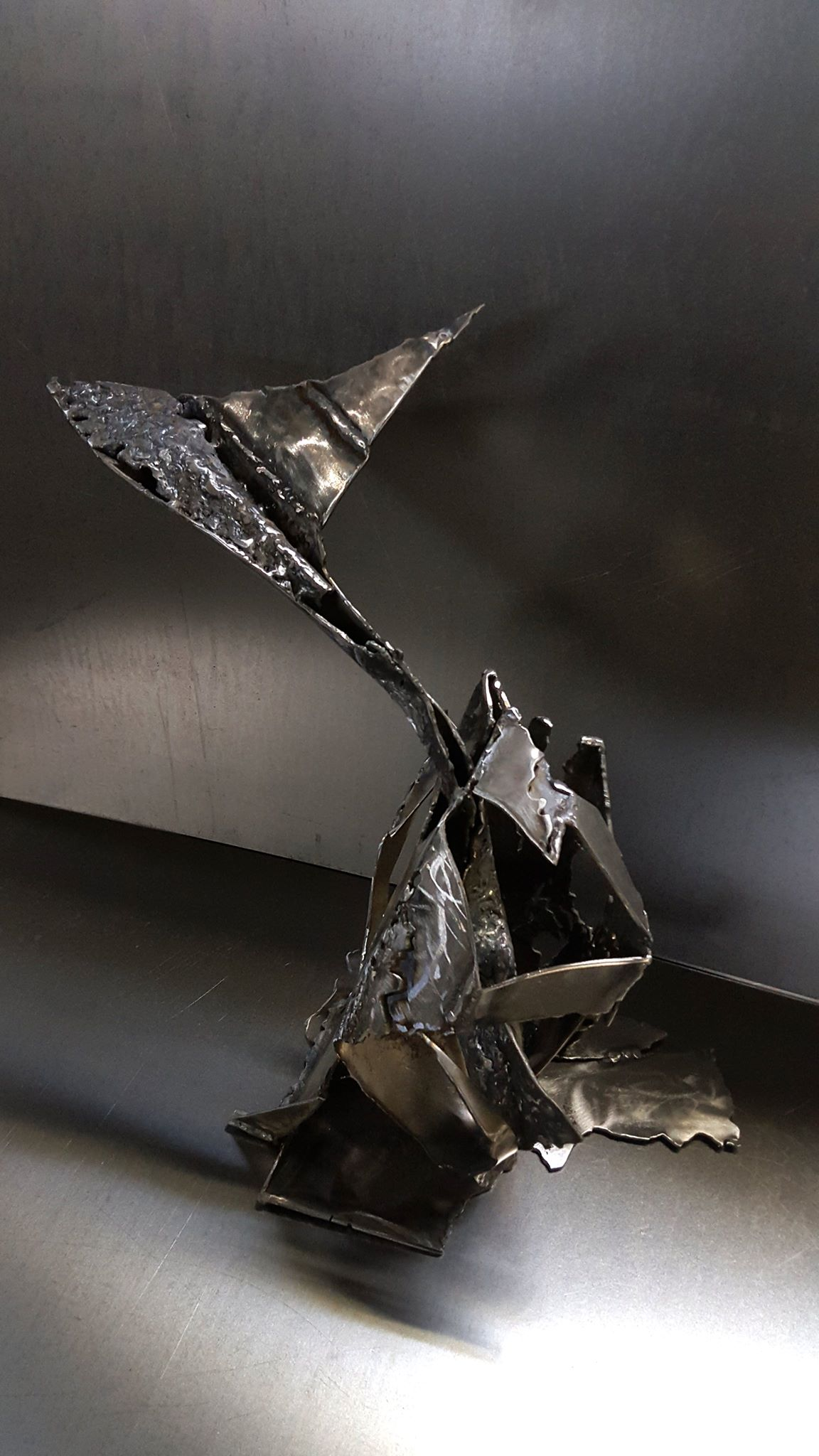 The genesis of flight welded iron sculpture by O KLOSKA / Available